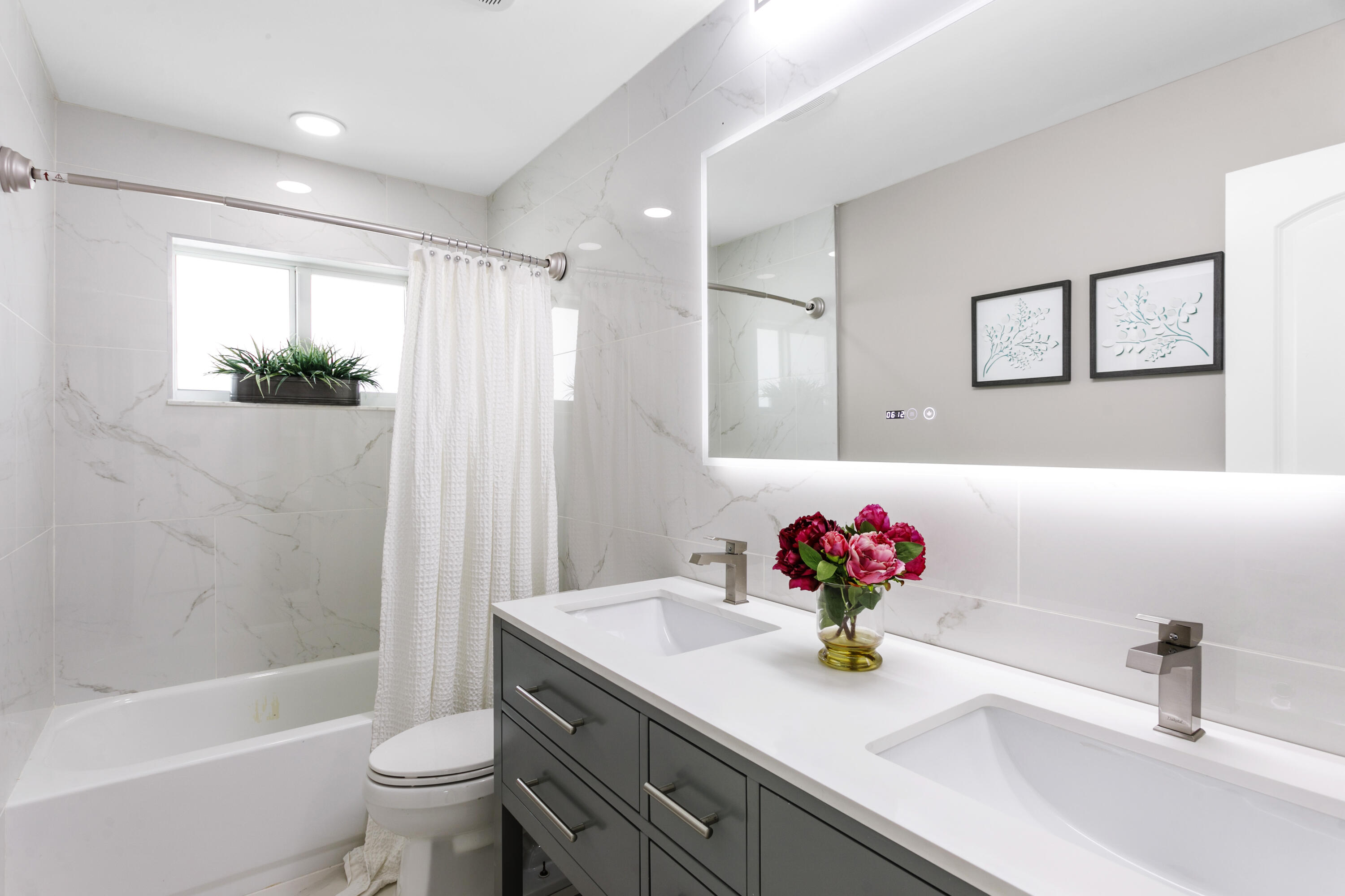 5200 Club Road Haverhill, FL 33415 - Photo 23 of 33 a bathroom with a sink a toilet and a bathtub
