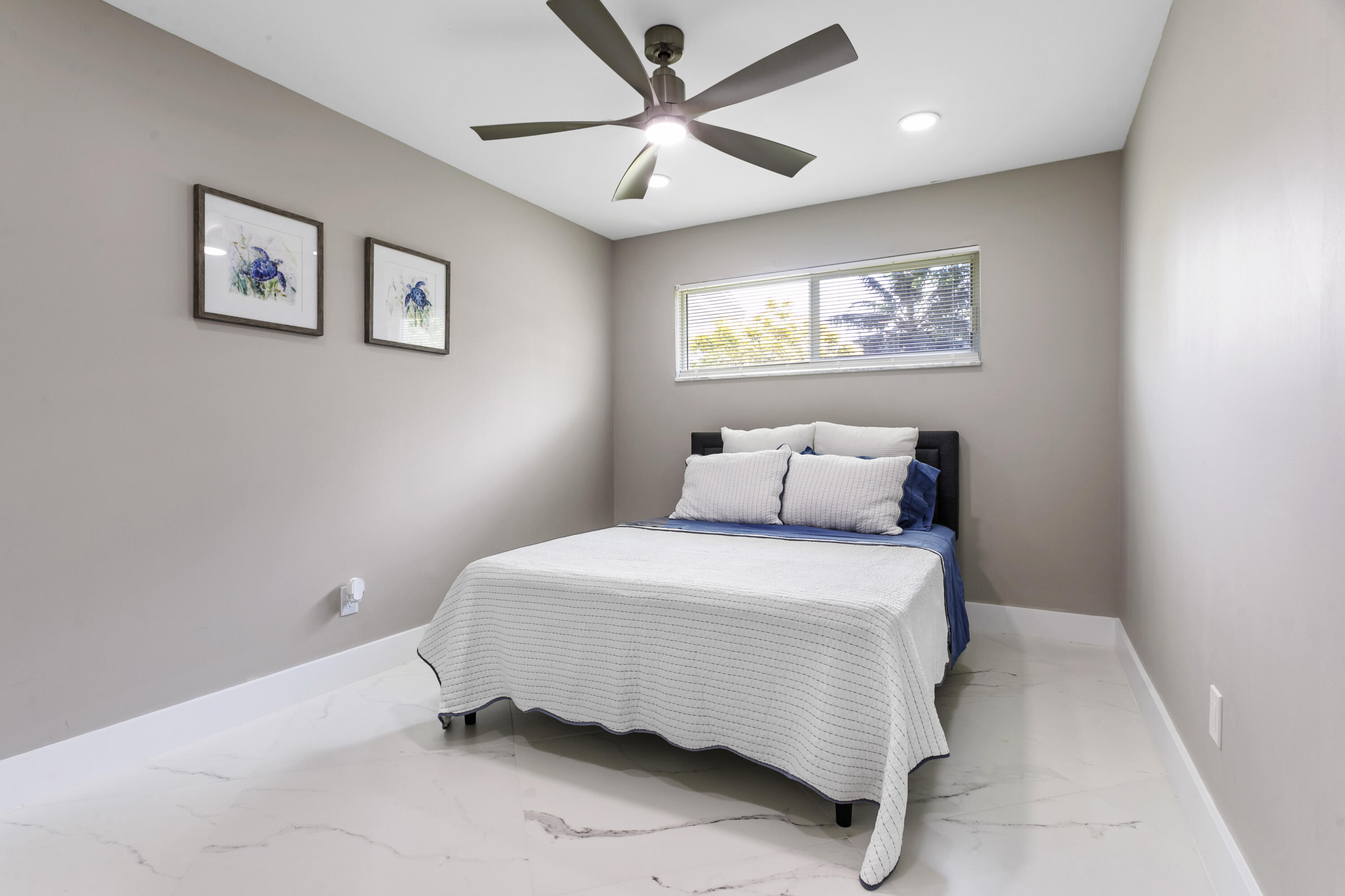 5200 Club Road Haverhill, FL 33415 - Photo 24 of 33 a bedroom with a bed and painting on the wall