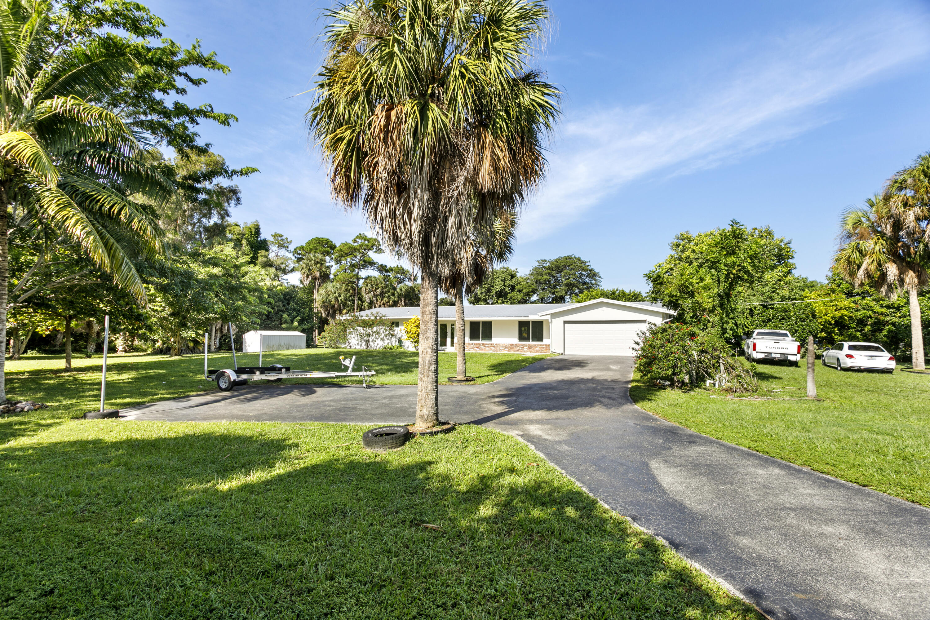 5200 Club Road Haverhill, FL 33415 - Photo 31 of 33 a view of a house with a yard
