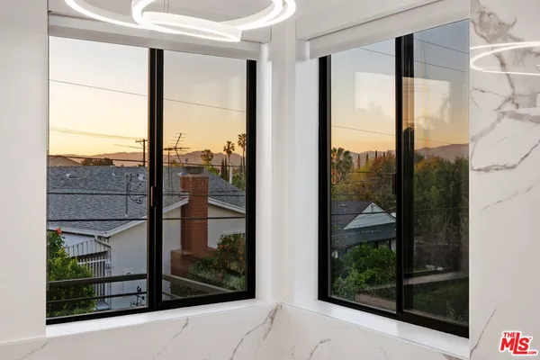 a view of a glass door and a window
