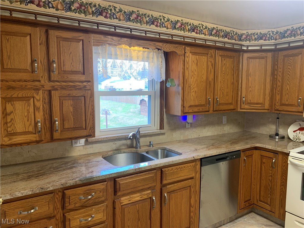 16879 Ridgeview Drive East Liverpool, OH 43920 - Photo 10 of 22 Kitchen featuring sink, backsplash, light stone countertops, white range with electric cooktop, and stainless steel dishwasher