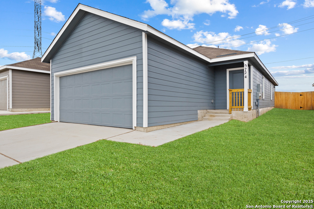 5724 Mangas Circle Seguin, TX 78155 - Photo 13 of 17 a front view of house with yard and green space