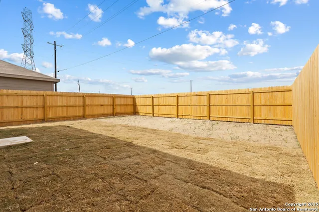 a view of a backyard of the house