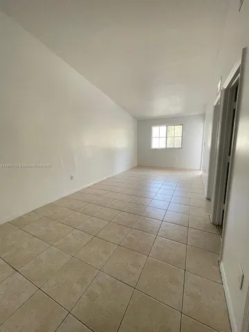 a view of a livingroom and window