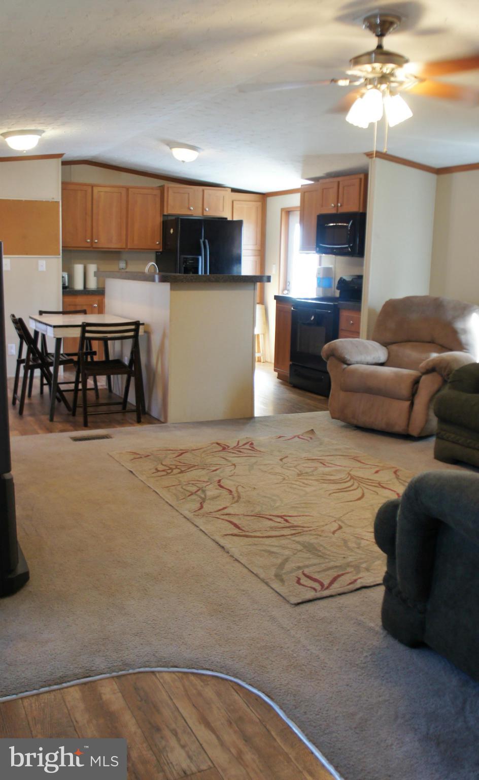 118 German Chapel Road Prince Frederick, MD 20678 - Photo 2 of 27 a living room with stainless steel appliances kitchen island granite countertop furniture and a kitchen view
