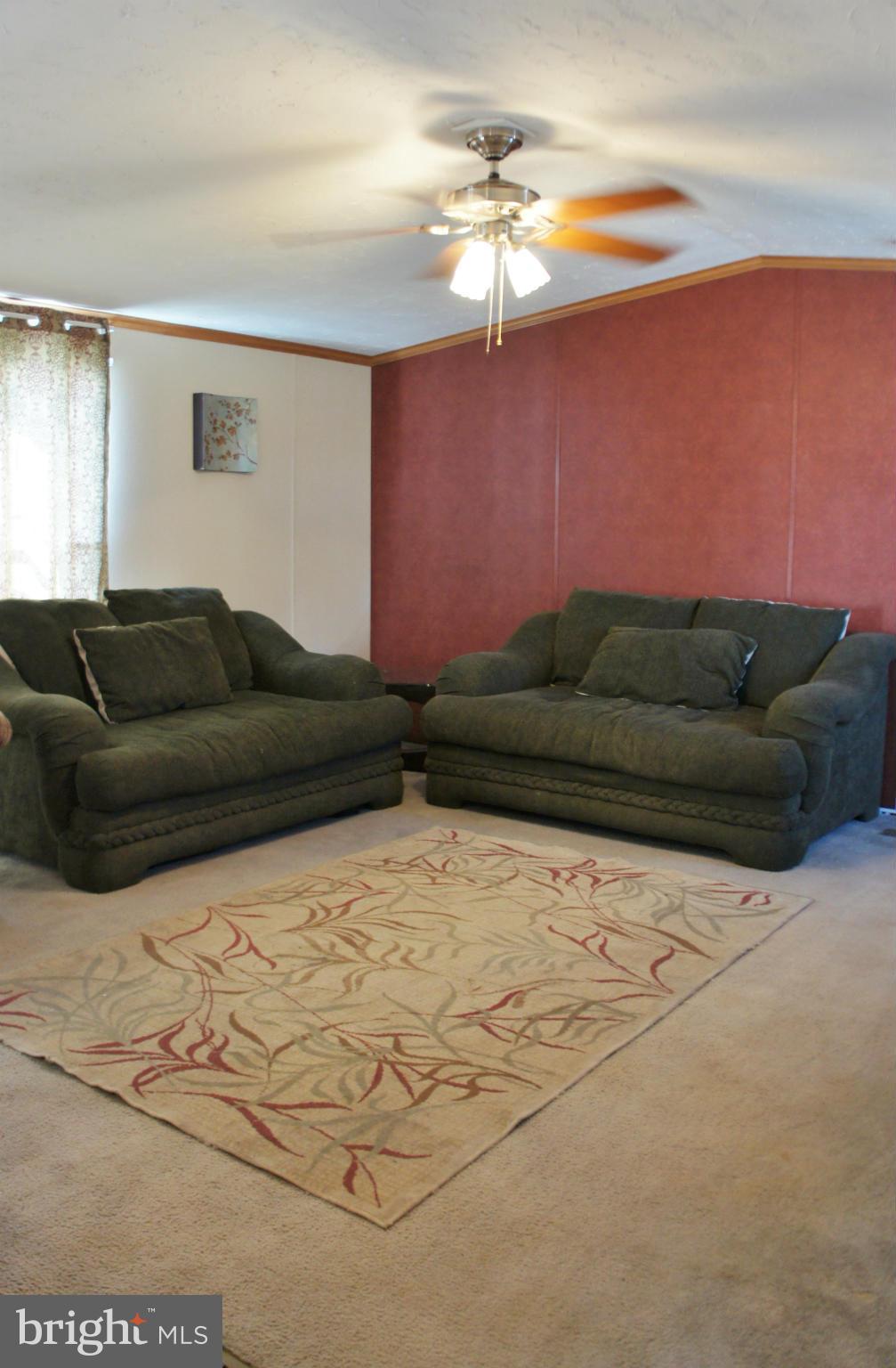 118 German Chapel Road Prince Frederick, MD 20678 - Photo 3 of 27 a living room with furniture and a chandelier