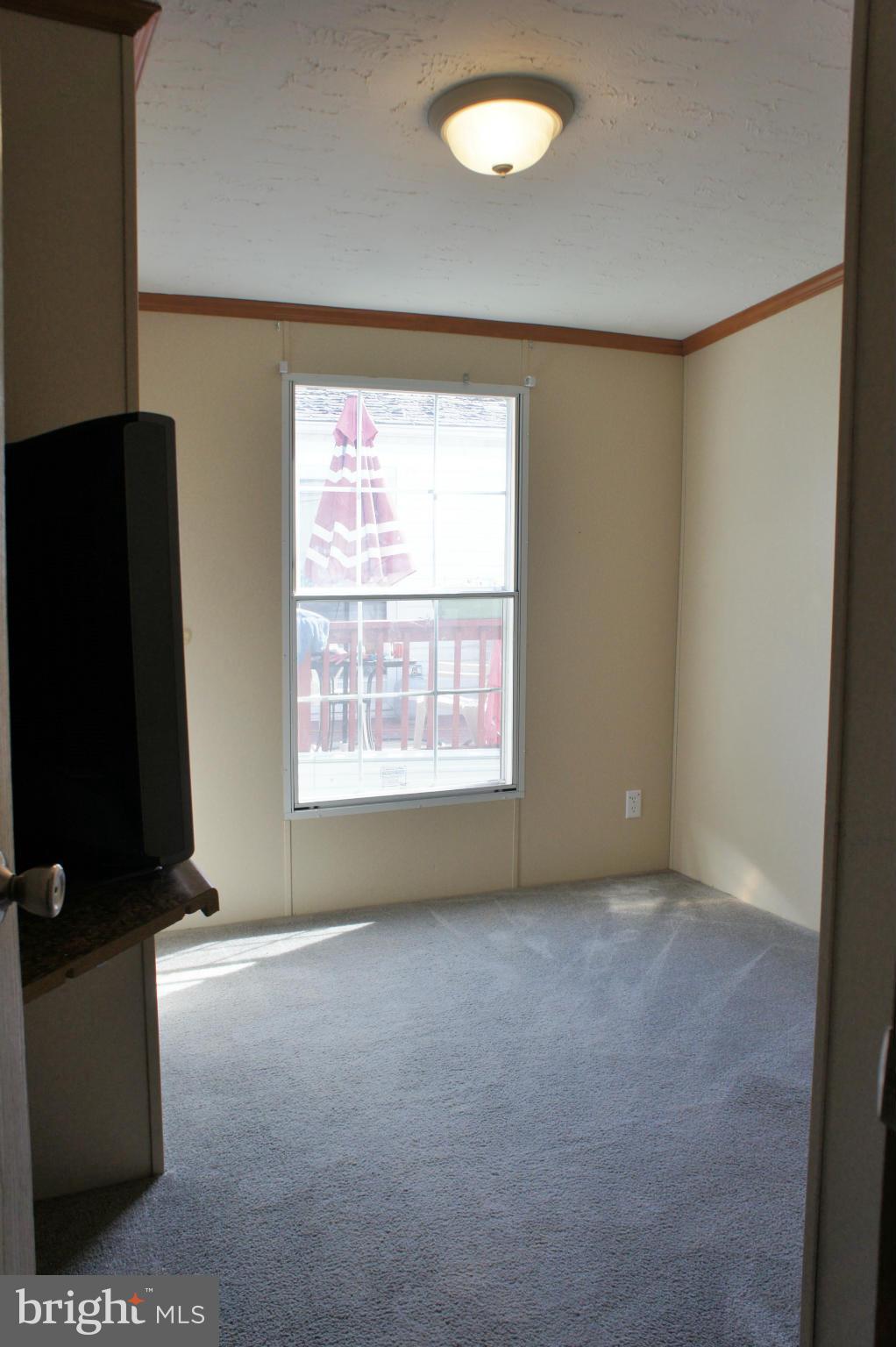 118 German Chapel Road Prince Frederick, MD 20678 - Photo 23 of 27 an empty room with a empty space and a window