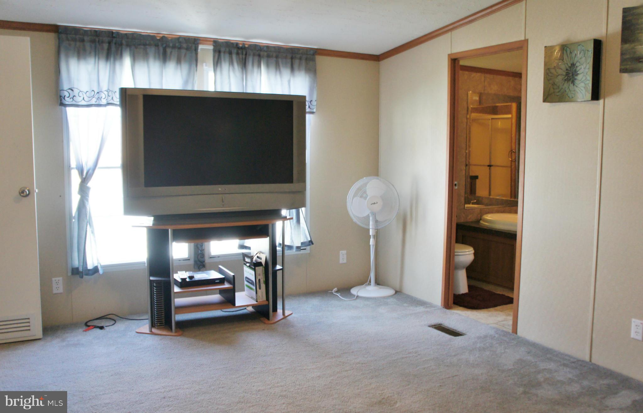 118 German Chapel Road Prince Frederick, MD 20678 - Photo 10 of 27 a view of livingroom with furniture and a fireplace