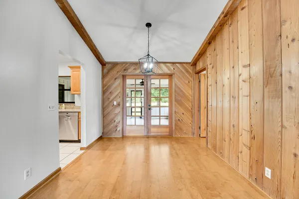 a view of a room with window and kitchen view