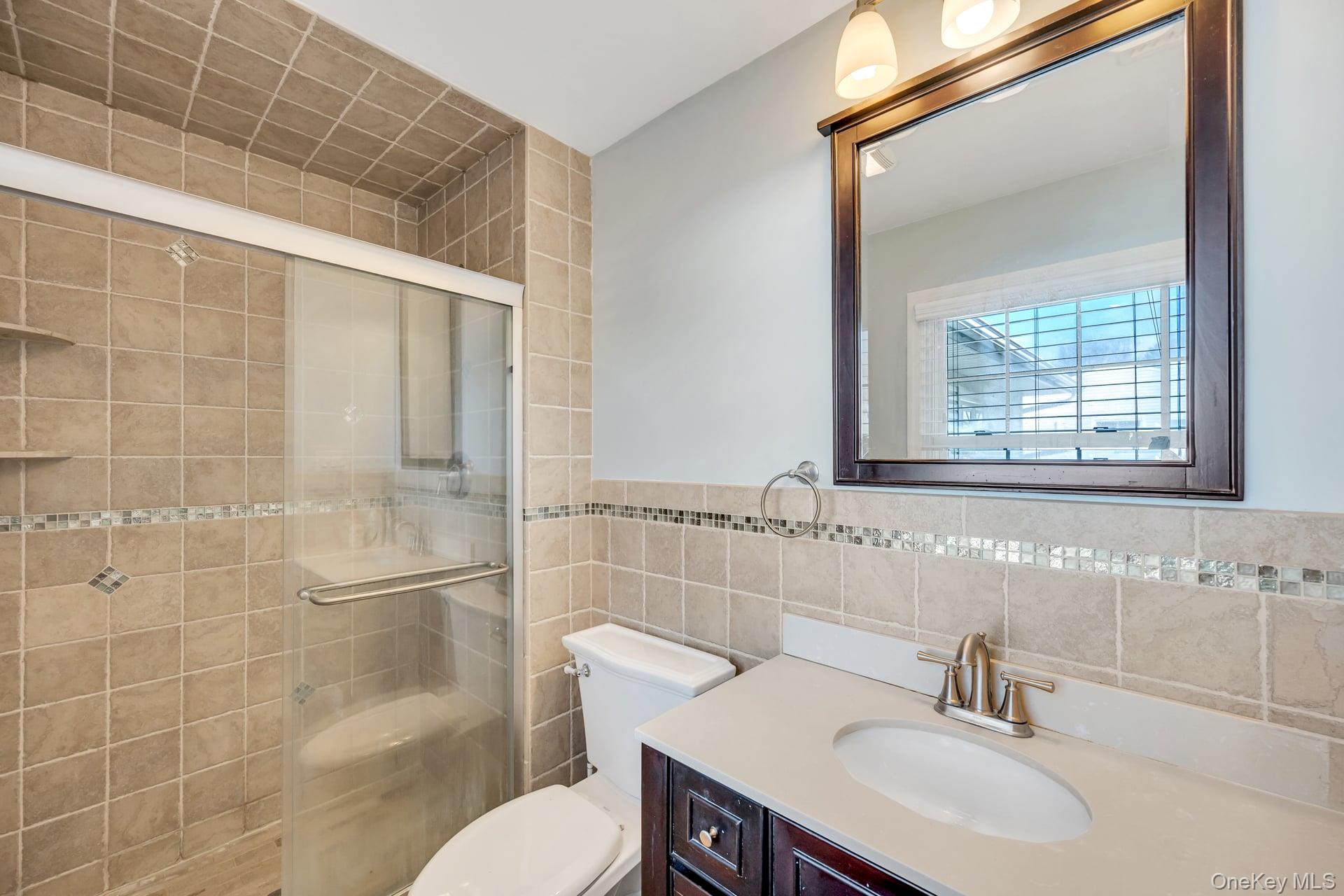 27 Westbrook Road Coram, NY 11727 - Photo 14 of 25 Updated Bathroom