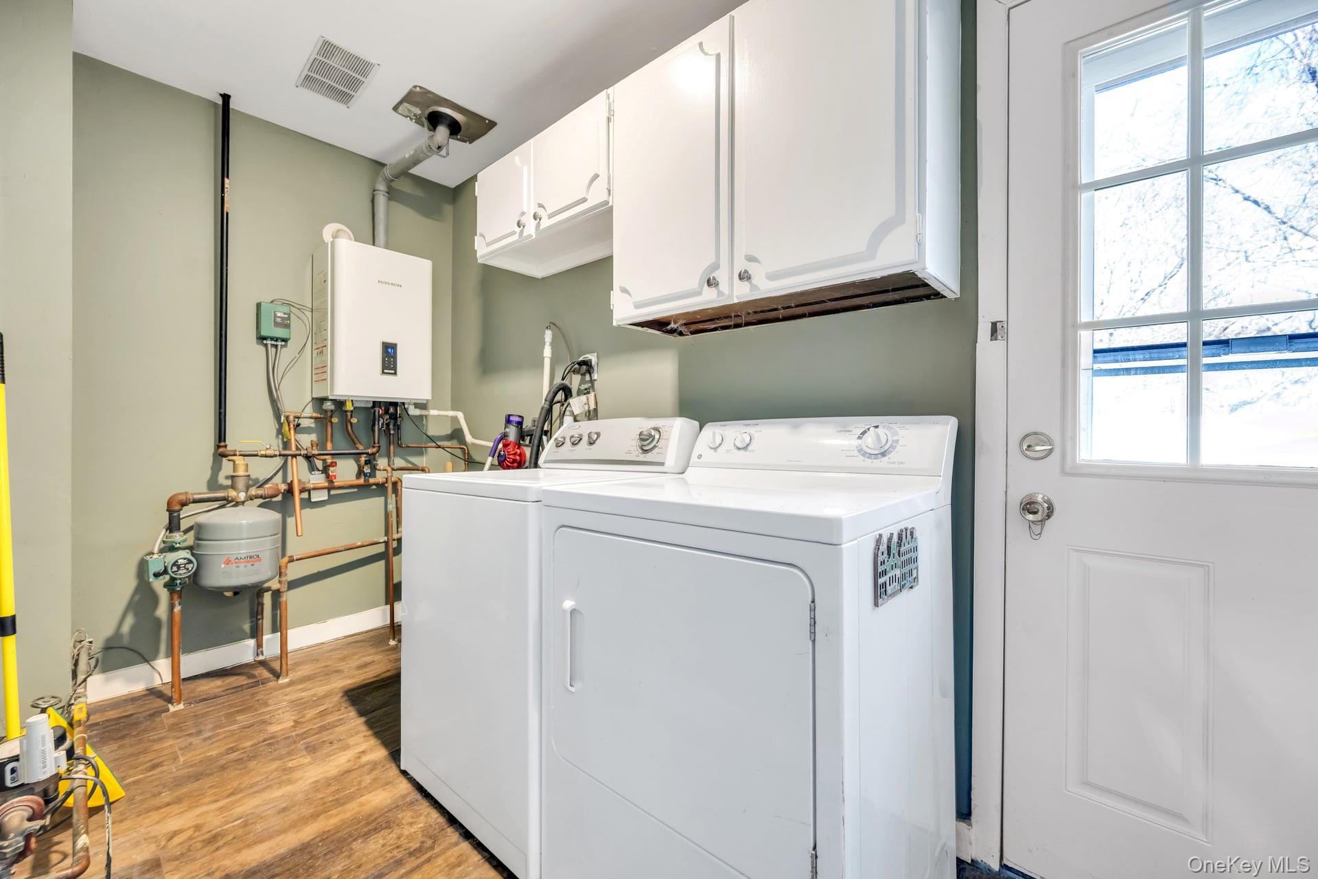 27 Westbrook Road Coram, NY 11727 - Photo 21 of 25 Large Laundry Room and Boiler Room with 2 Year Old Navien Gas Burner
