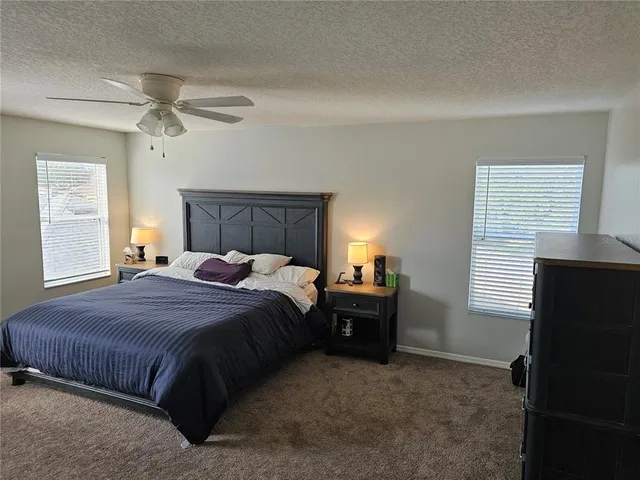 a bed room with a bed and a window