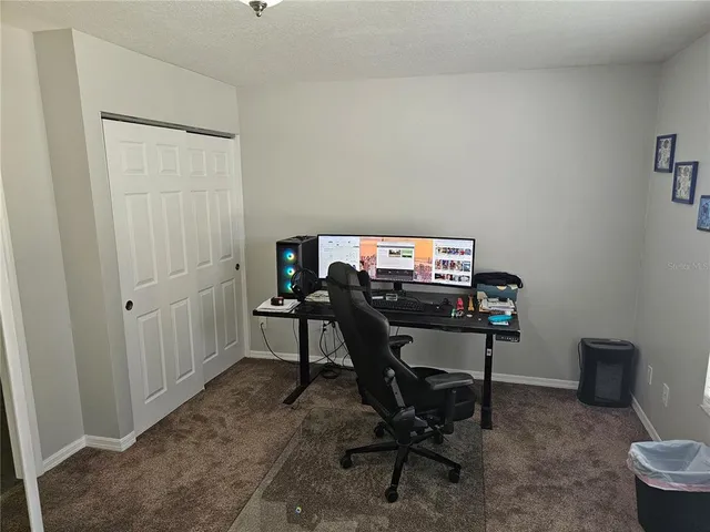 a view of a workspace with furniture