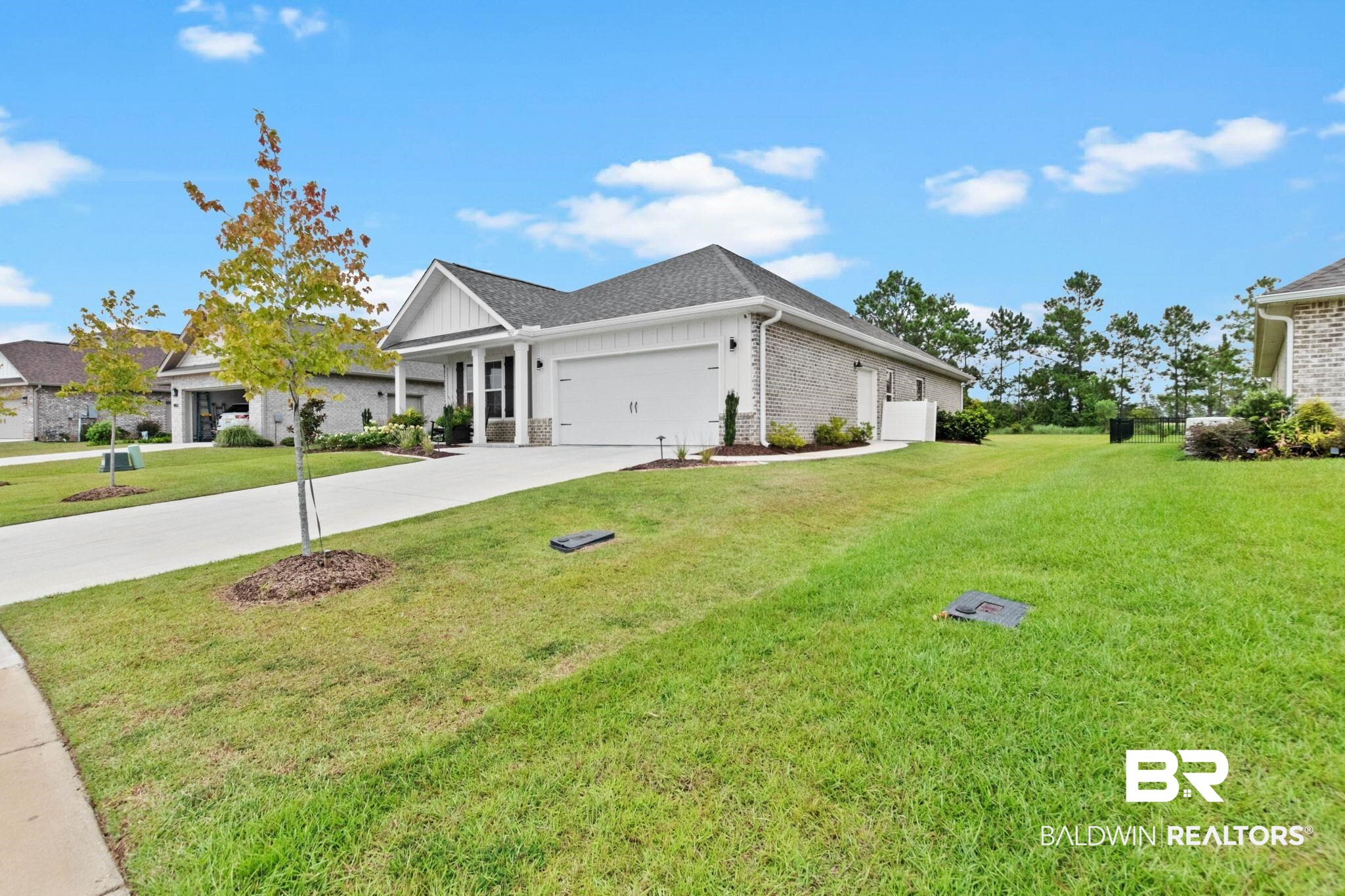 9815 Lakeview Drive Foley, AL 36535 - Photo 6 of 100 View of front of home with a front yard and a garage