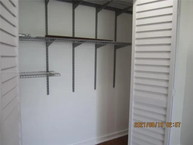 a kitchen with a refrigerator and window