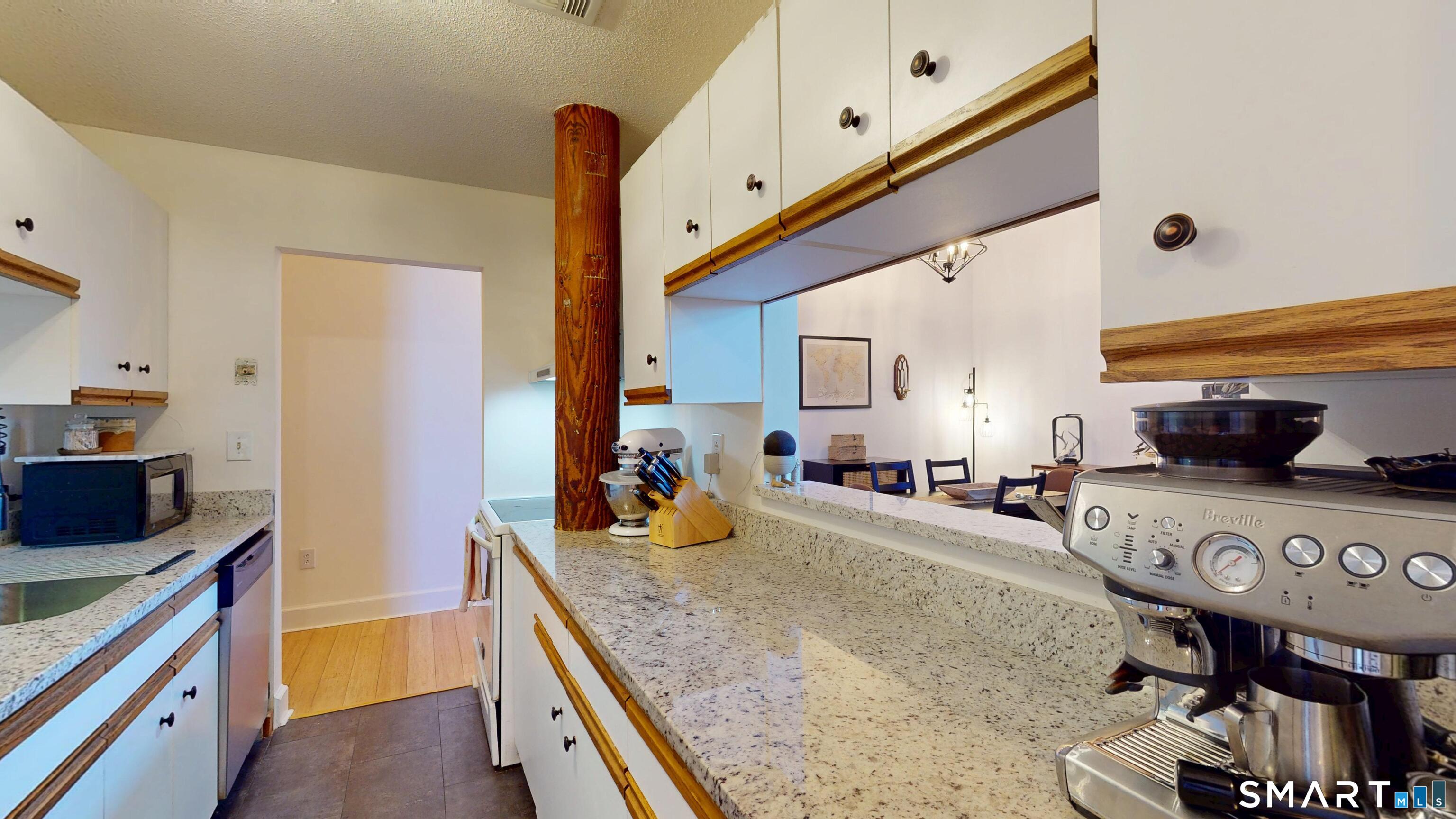 45 Main Street Plainfield, CT 06374 - Photo 14 of 20 a kitchen with stainless steel appliances granite countertop a sink a stove and a refrigerator