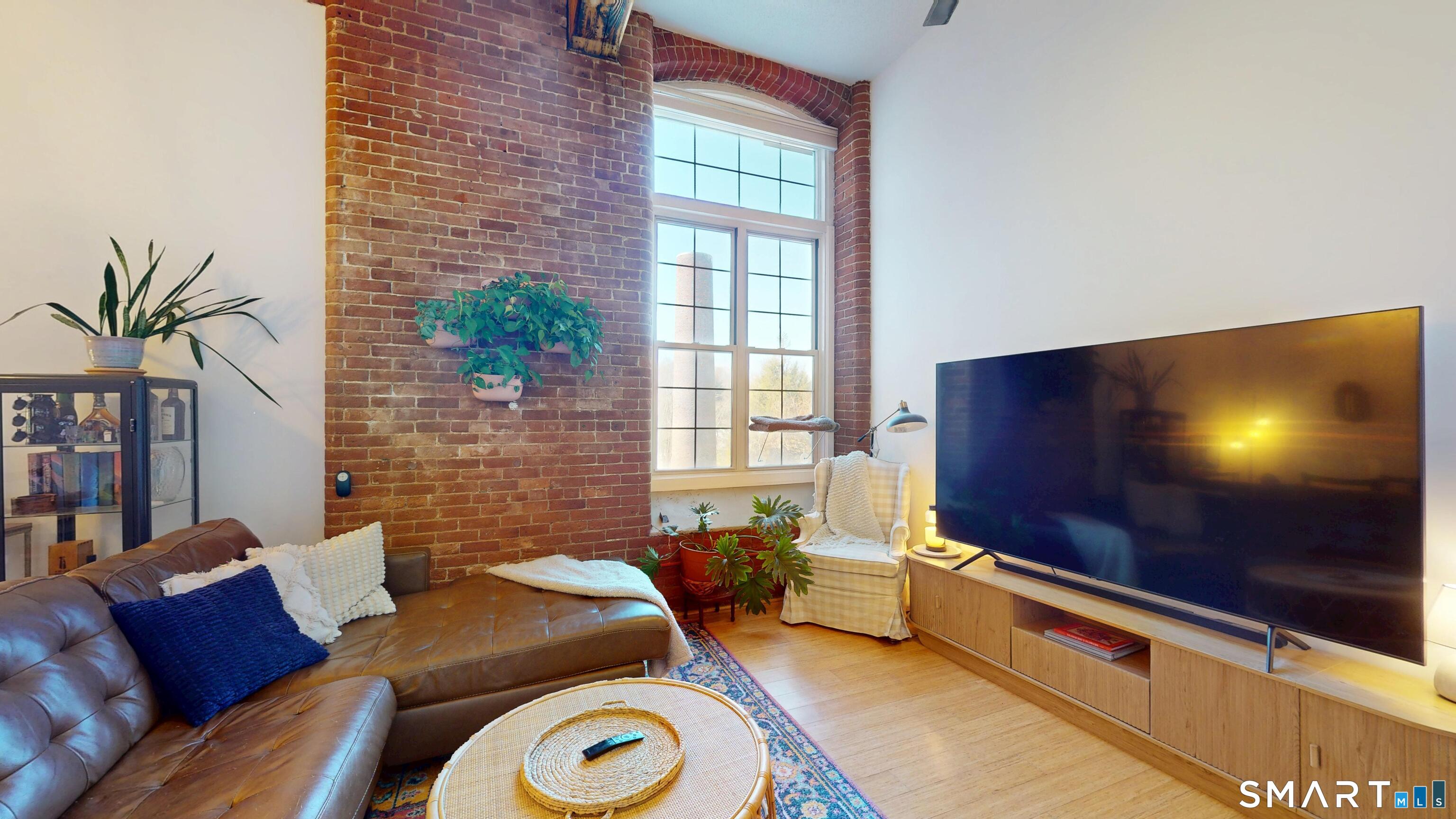45 Main Street Plainfield, CT 06374 - Photo 4 of 20 a living room with furniture and a flat screen tv