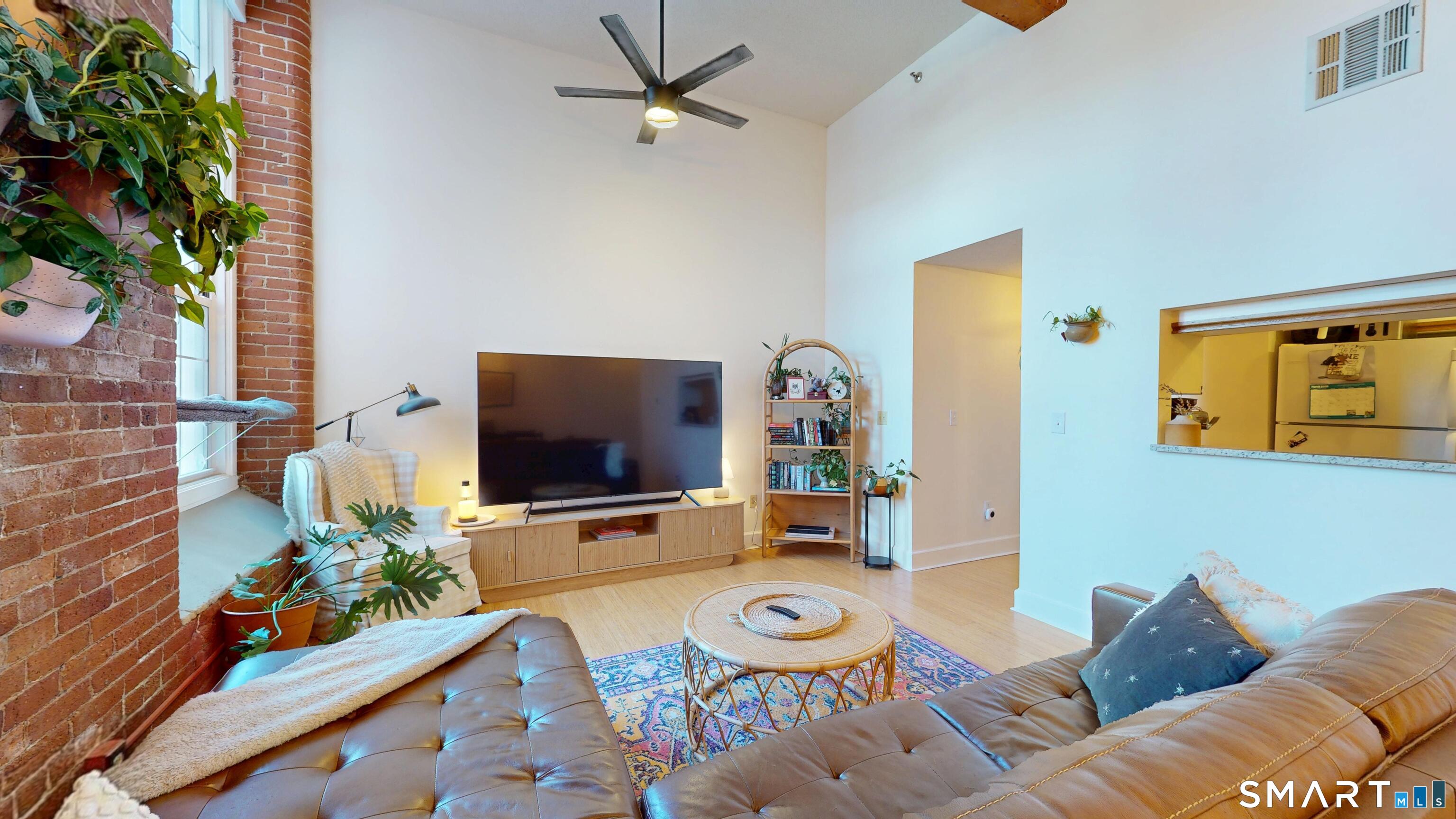 45 Main Street Plainfield, CT 06374 - Photo 5 of 20 a living room with furniture and a flat screen tv