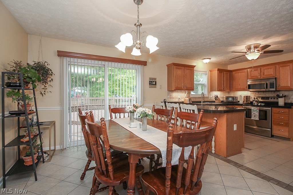 1001 Susan Road Ravenna, OH 44266 - Photo 6 of 35 Dining area with access to outdoor entertaining areas and kitchen.