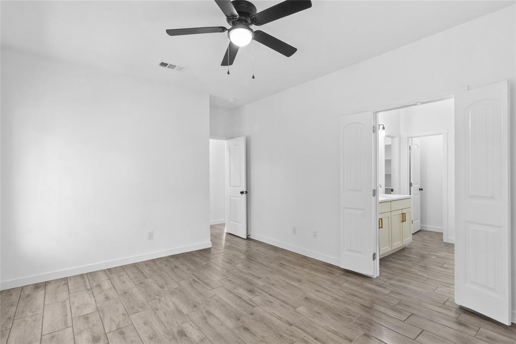 7520 Double Bridge Road Mabank, TX 75156 - Photo 16 of 32 Spacious room with wood-finish flooring and a ceiling fan