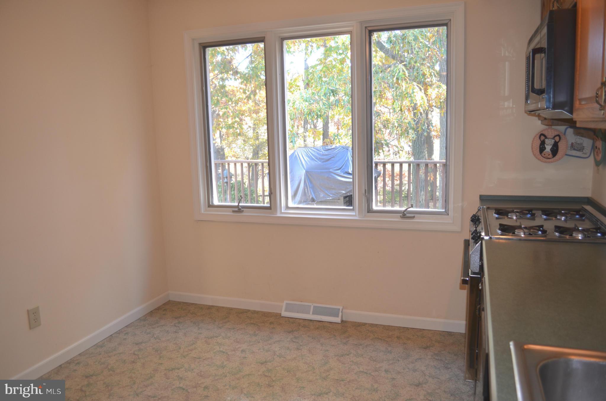 213 Garnett Road Joppa, MD 21085 - Photo 9 of 30 Room for Table w/3 Casement Pella Windows