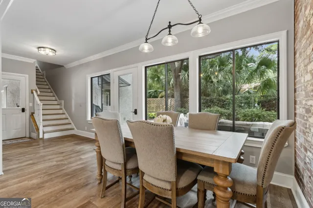 a bedroom with a bed a dresser and a window