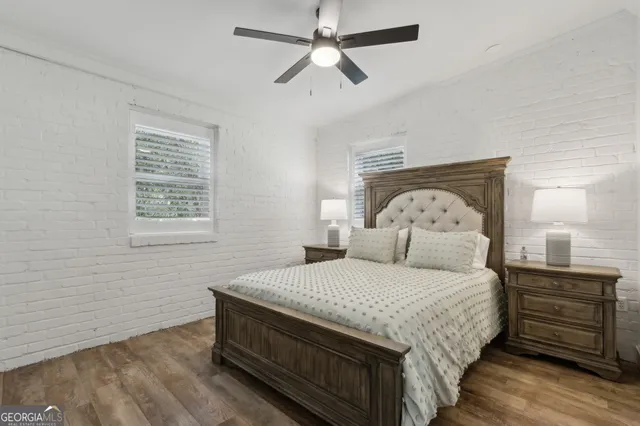a bathroom with a double vanity sink mirror and shower