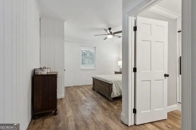 a bathroom with a tub sink toilet and a mirror