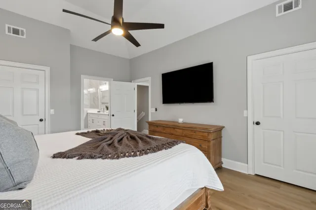 a living room with furniture or wooden floor and a large window