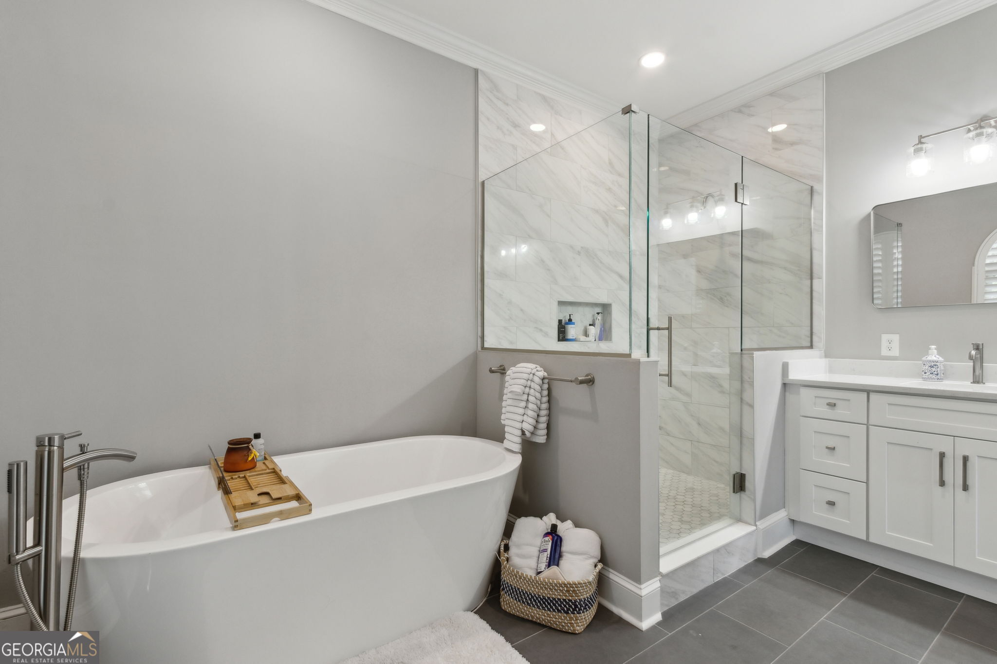 6 Stewart Lane Jekyll Island, GA 31527 - Photo 37 of 95 a bathroom with a tub sink toilet and a mirror