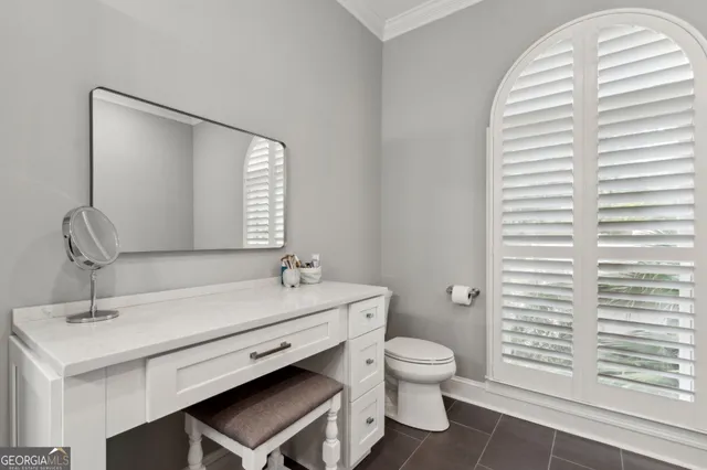 a view of a house with a wooden deck