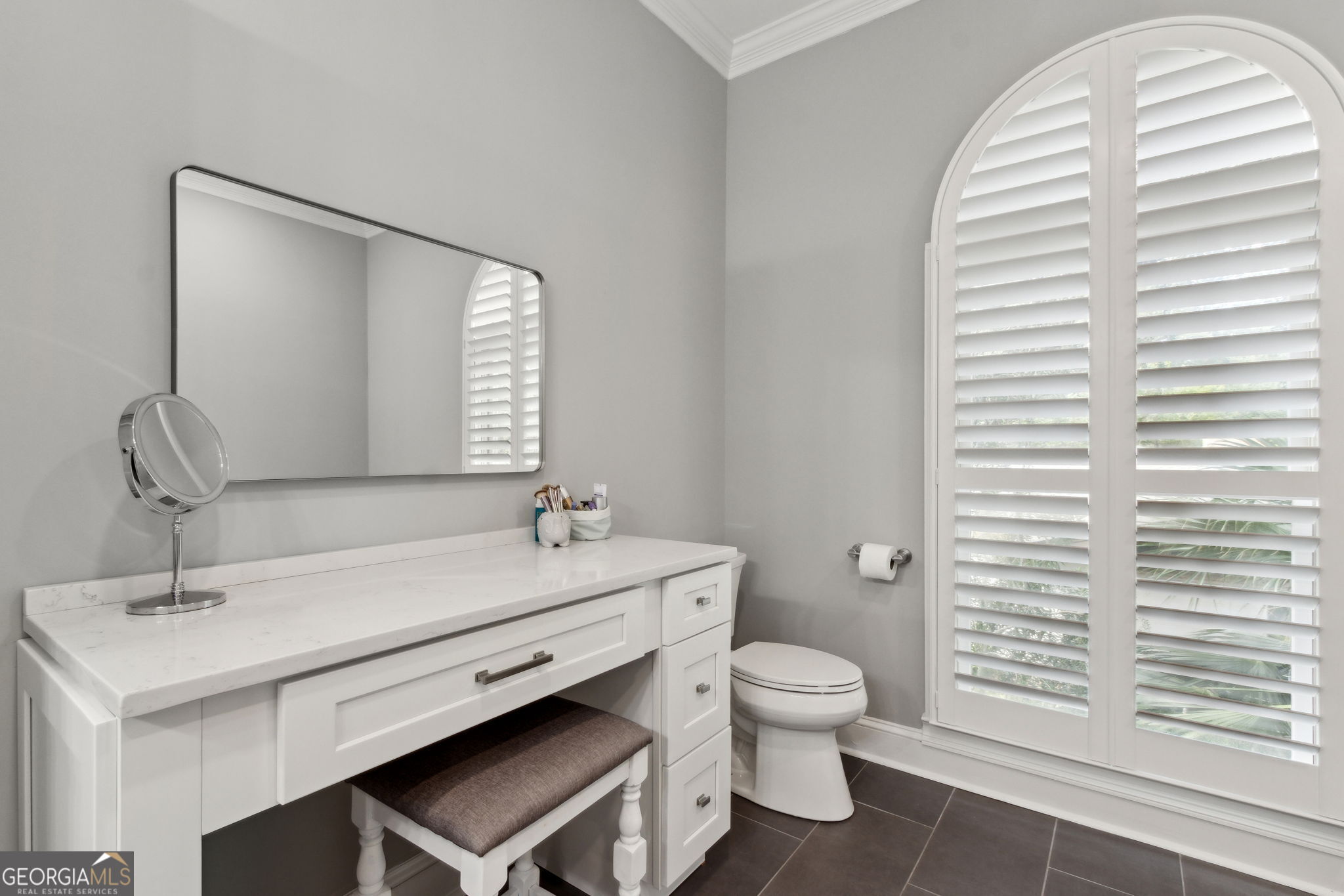 6 Stewart Lane Jekyll Island, GA 31527 - Photo 39 of 95 a bathroom with a sink a toilet and a mirror