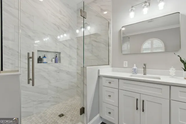 a view of a patio with couches and a table and chairs with wooden fence