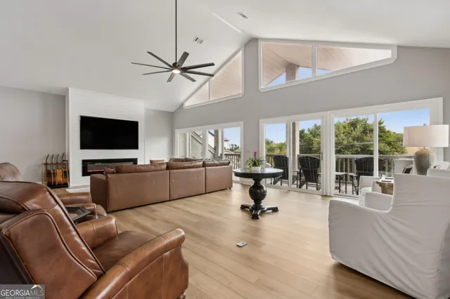 an aerial view of a houses with a yard