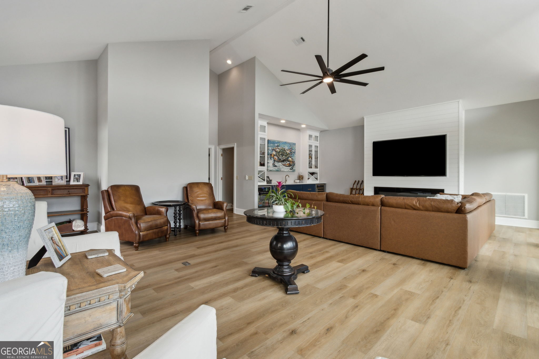 6 Stewart Lane Jekyll Island, GA 31527 - Photo 49 of 95 a living room with furniture and a flat screen tv
