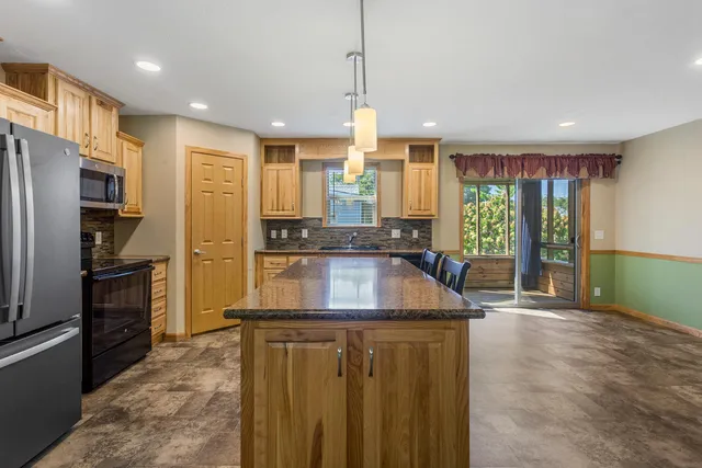 a kitchen with counter top space cabinets and stainless steel appliances