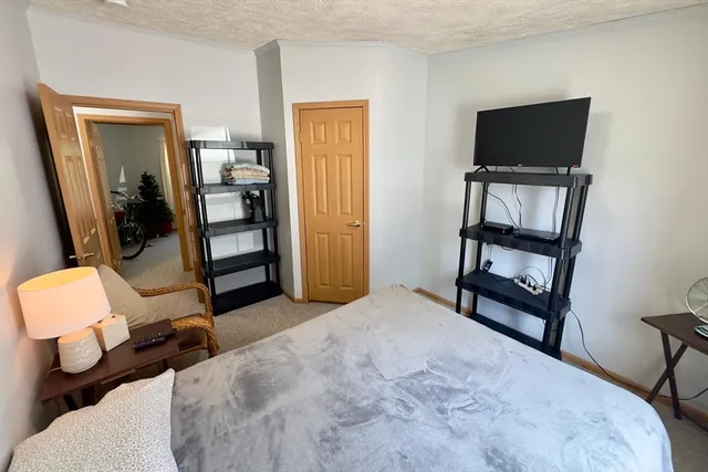 a bedroom with a bed and furniture