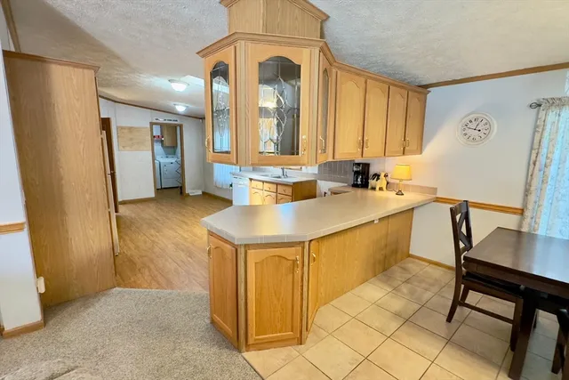 a kitchen with sink and refrigerator
