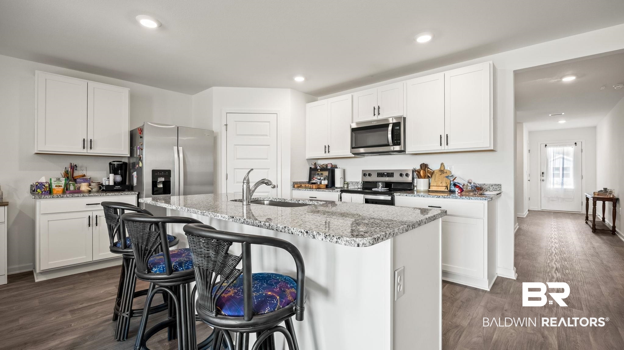 24264 Veranda Circle Elberta, AL 36530 - Photo 27 of 41 Kitchen with white cabinets, light stone counters, appliances with stainless steel finishes, recessed lighting, and dark wood finished floors