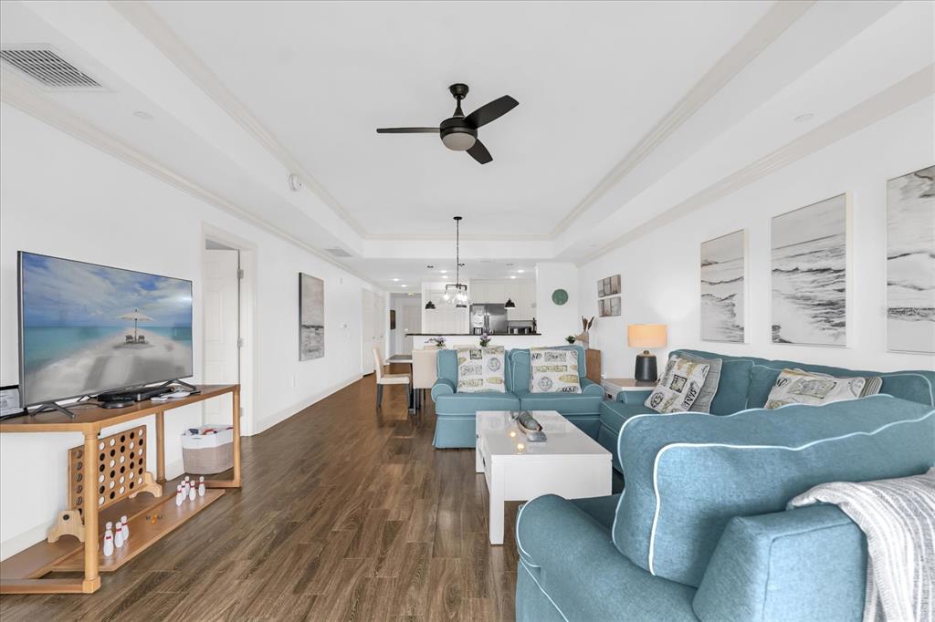 1362 Centre Ct Ridge Drive, Unit 102 Reunion, FL 34747 - Photo 7 of 35 a living room with furniture and a flat screen tv