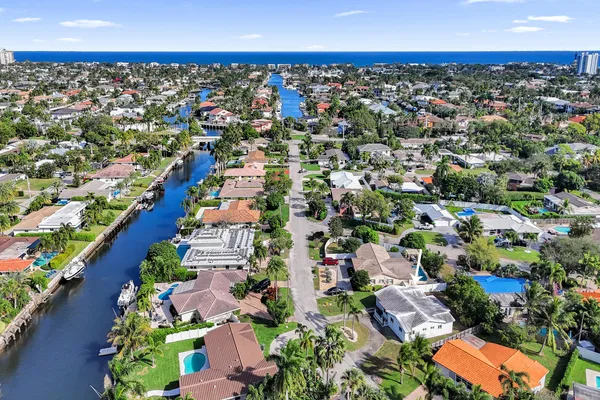an aerial view of residential houses with outdoor space