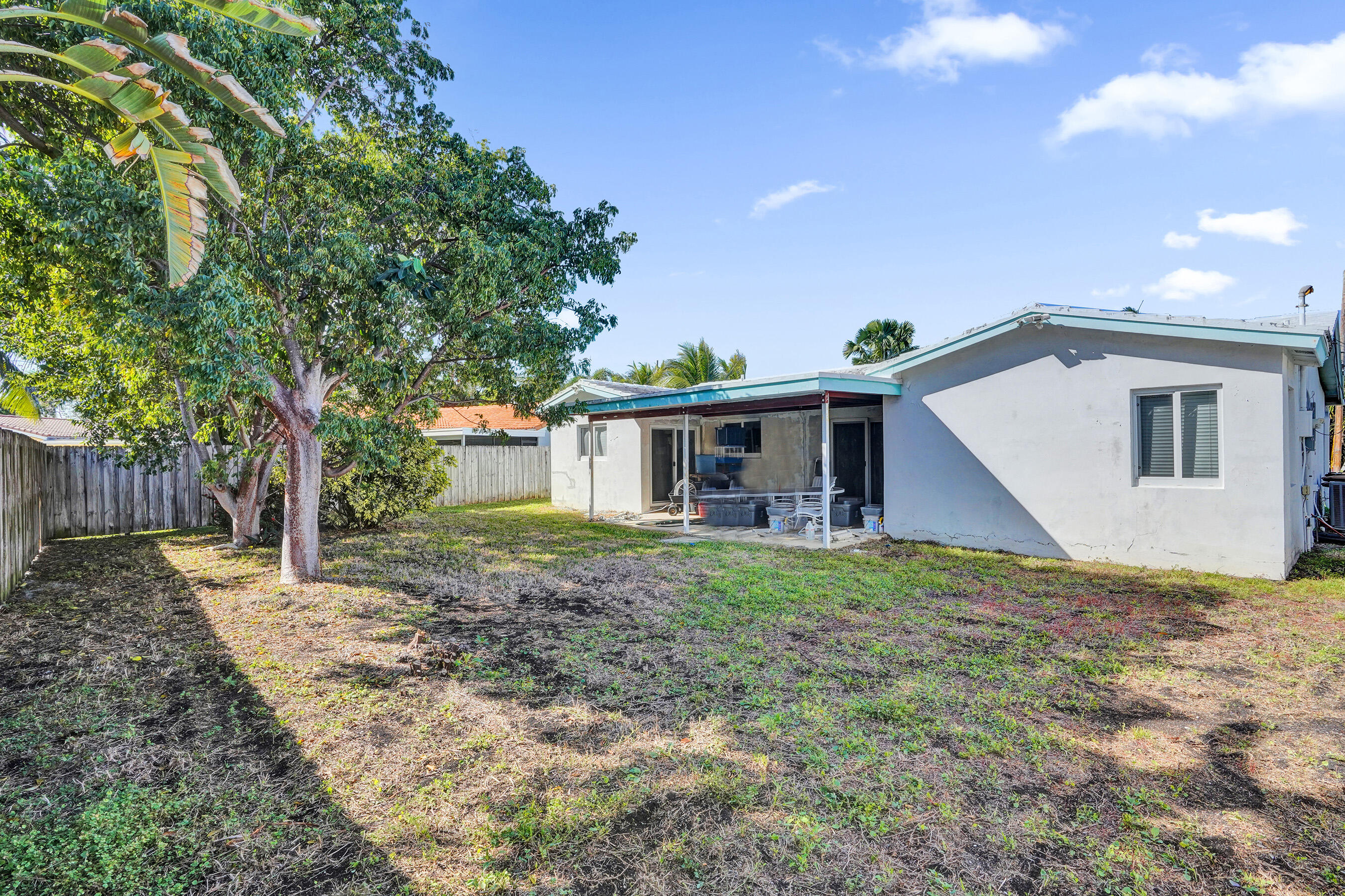 2110 Northeast 29th Street Lighthouse Point, FL 33064 - Photo 9 of 11 a view of a house with a backyard