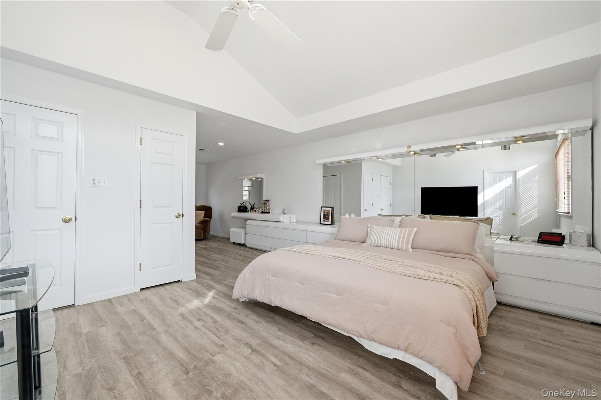 1853 Decatur Avenue Merrick, NY 11566 - Photo 22 of 43 a large white bed in a white room