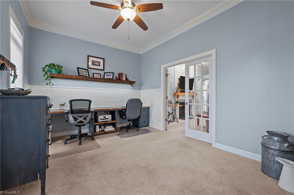 7602 Wilson Farm Road Summerfield, NC 27358 - Photo 14 of 50 Living room being used as an office space, enough space for two desk spaces.