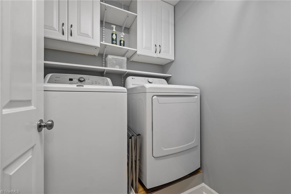 7602 Wilson Farm Road Summerfield, NC 27358 - Photo 23 of 50 Walk-in laundry space with cabinets