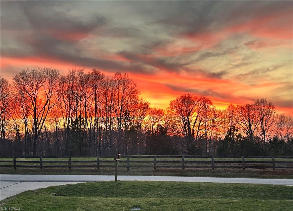 7602 Wilson Farm Road Summerfield, NC 27358 - Photo 50 of 50 Enjoy sunsets on the front porch, overlooking large common area.