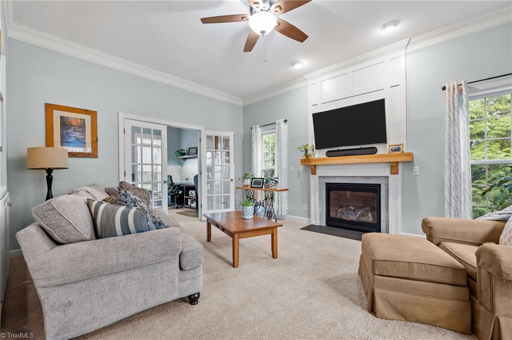 7602 Wilson Farm Road Summerfield, NC 27358 - Photo 5 of 50 Den w/gas logs, built-in shelves, plenty of natural light