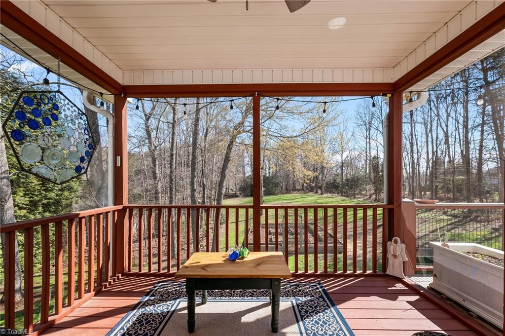 7602 Wilson Farm Road Summerfield, NC 27358 - Photo 7 of 50 Screened porch overlooking quiet backyard