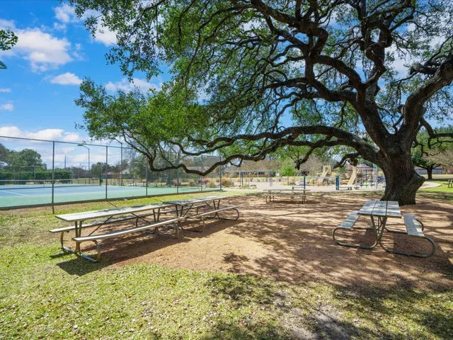 a view of a swimming pool with an outdoor space and seating area