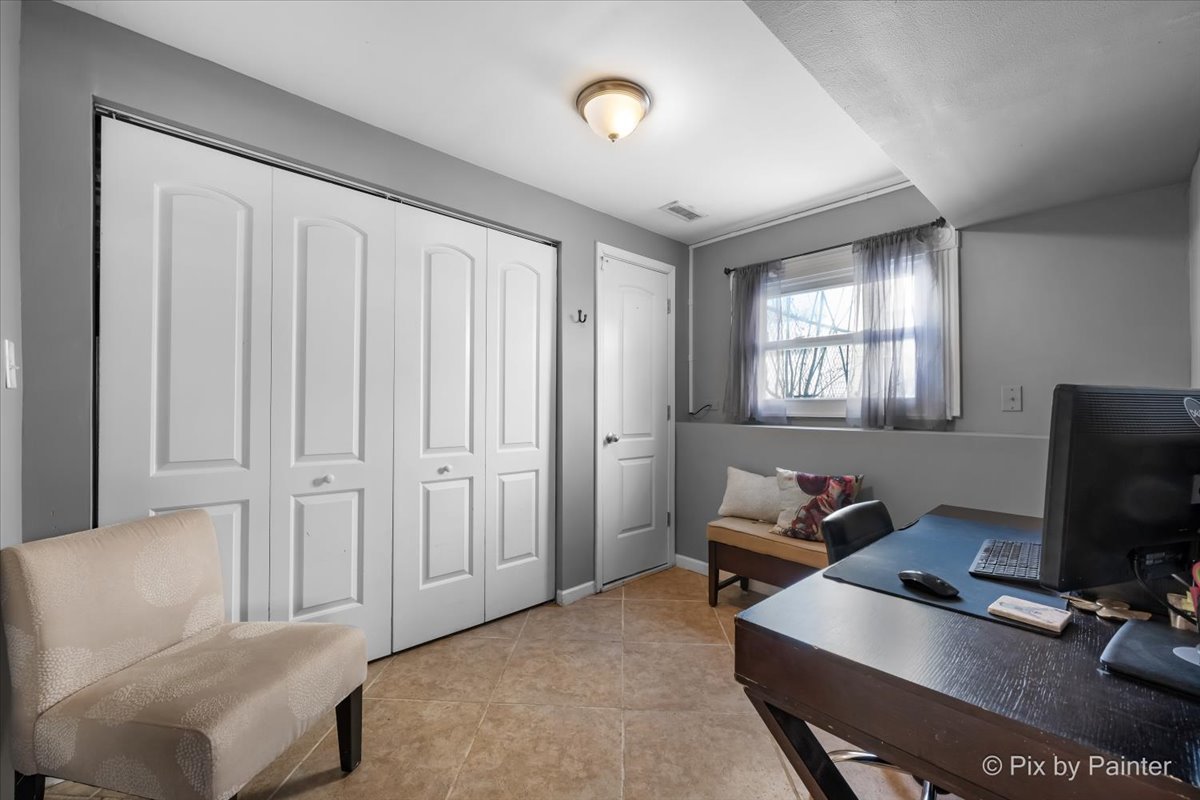 320 Homestead Drive Bolingbrook, IL 60440 - Photo 13 of 33 a living room with furniture and a flat screen tv